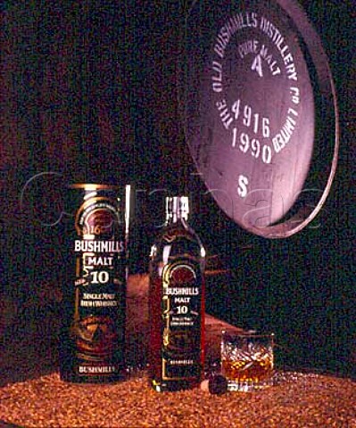 Bottle and glass of Bushmills 10 Year Old Malt   Whiskey in warehouse of Old Bushmills Distillery   Bushmills CoAntrim Northern Ireland