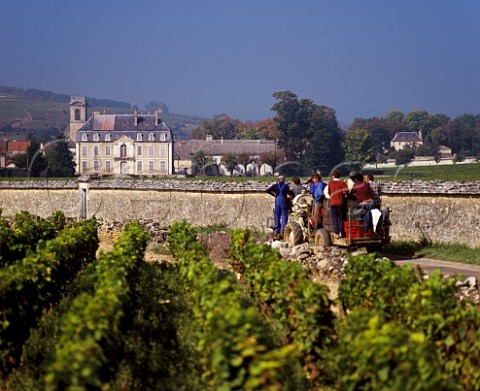 Grape pickers on tractor passing Chteau Pommard Pommard Cte dOr France   Cte de Beaune