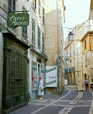 Bookshop and bakers in old Perigueux Dordogne