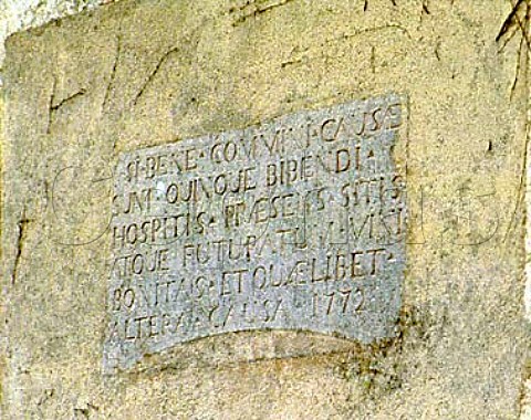 One of the 15 or so inscriptions in the wine village   of SavignylesBeaune This one in Latin and dated   1772 is on the facade of the old cuverie of the   monks of the town    Cote de Beaune