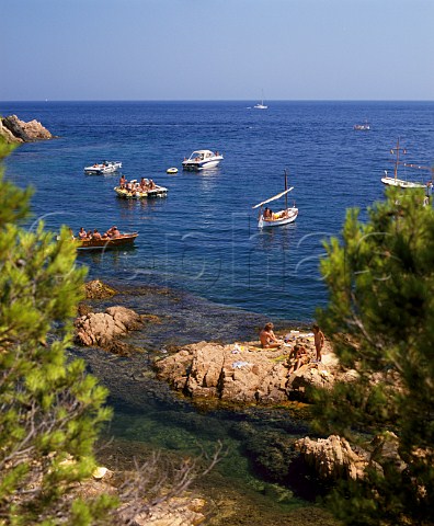 Boats in the sheltered cove at Agua Gelida on the Costa Brava near Palafrugell Catalonia Spain