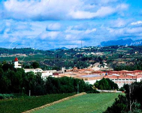 The bodegas of Codorniu with the Sierra de   Montserrat in the distance Sant Sadurni dAnoia   Catalonia Spain Penedes DO