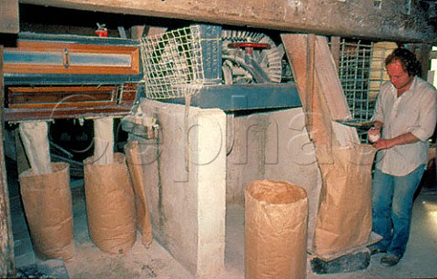 Bagging flour at Burton Water mill   Petworth Sussex