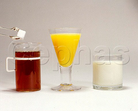 Glasses of tea orange juice and milk