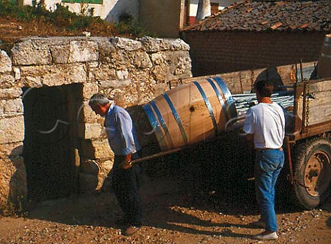 Carrying a new wine barrel into a cellar   Valbuena de Duero Spain Ribers del Duero