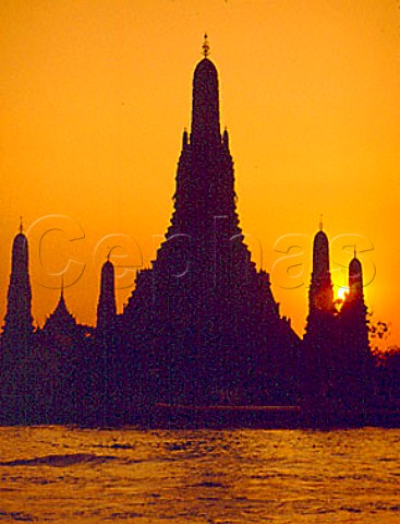 Sunset over Wat Arun Temple and Chao Phraya River Bangkok Thailand
