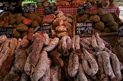 Charcuterie stall   market day in   lIslesurlaSorgue Vaucluse France