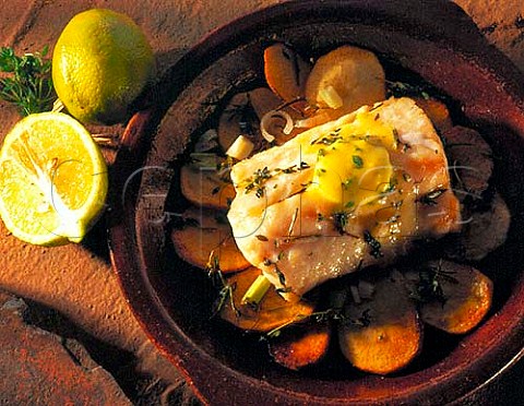 Fish roasted on a bed of saut potatoes with herbs