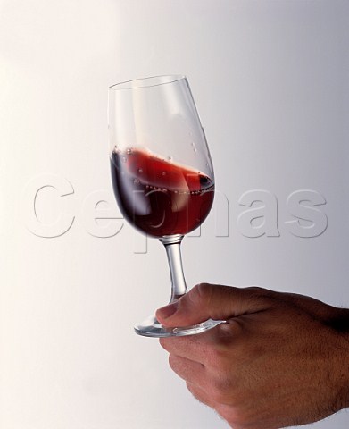 Swirling red wine in a glass