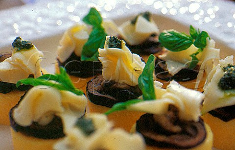 Aubergine topped with Mozzarella   polenta and basil