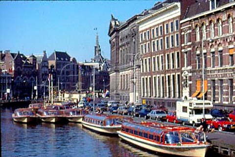 Tourist boats on Rokin Canal Amsterdam   The Netherlands