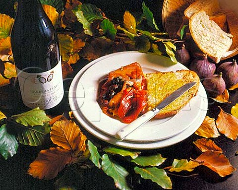 Piemonte food and wine  Bruschetta with roast peppers and olives with bottle of Aldo Conterno Barbera dAlba