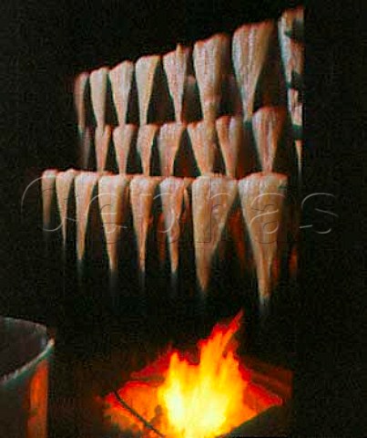 Sides of haddock being smoked in the kiln at  AHJarvis and Sons Kingston upon Thames Surrey