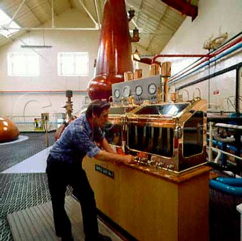 Checking levels in spirit safe at Glenfarclas   Distillery Ballindalloch Banffshire Scotland
