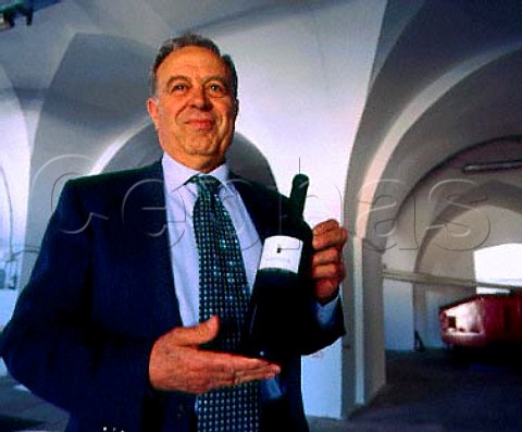 Severino Garofano with a bottle of Simposia his top   wine    Masseria Monaci Copertino Puglia Italy