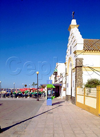 Restaurant and church on the waterfront in Sanlcar   de Barrameda Andalucia Spain