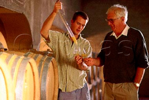 David Finlayson taking a sample of his   Chardonnay from barrel to taste with his   father Walter  Glen Carlou Paarl South Africa