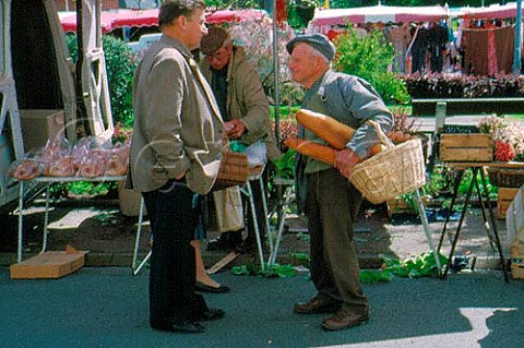 Two men talking in the street at Auffay   SeineMaritime France  Normandy