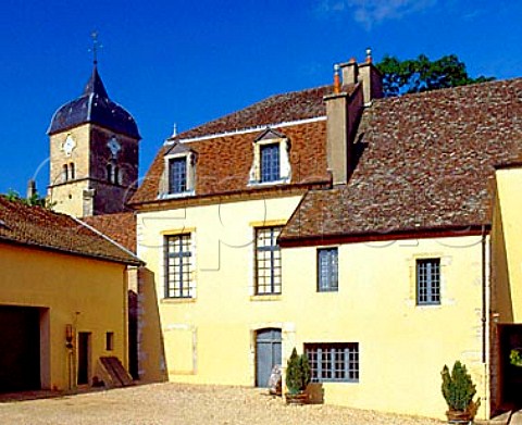 In the courtyard of   Domaine Comte Georges de Vog with the   village church behind ChambolleMusigny   Cte dOr France
