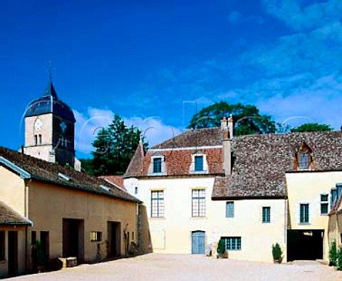 In the courtyard of Domaine Comte Georges de Vog   overlooked by the village church which was built by   his ancestors  ChambolleMusigny Cte dOr France