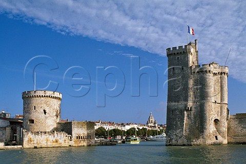 The towers of La Chaine and St Nicholas at the entrance to the ancient port of La Rochelle CharenteMaritime France  PoitouCharentes