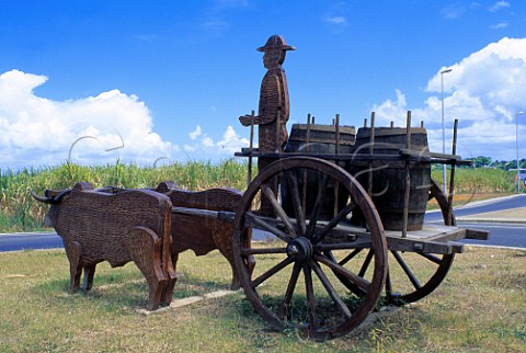 Ox cart sculpture carrying barrels of   rum Guadeloupe