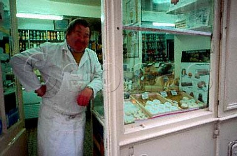 Bernard Lefranc at the door to his   Fromagerie Ile StLouis Paris France