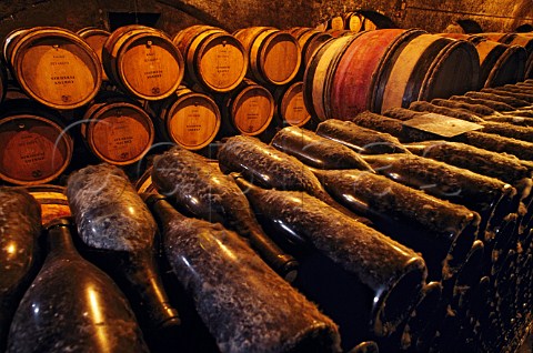 Bottles and barrels in the cellars of   Louis Latours Chteau de Grancey   AloxeCorton Cte dOr France