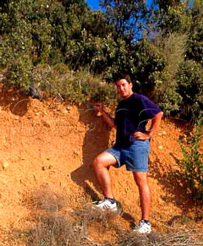 Samuel Guibert by a profile of the unusual soil of   Mas de Daumas Gassac the vineyards of which have   been cut from the garrigue Aniane Hrault France