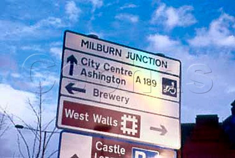 Milburn Junction road sign with   directions to Scottish and Newcastles   brewery producers of Newcastle Brown   Ale Newcastle England