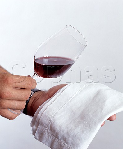 Judging the colour of red wine in a glass