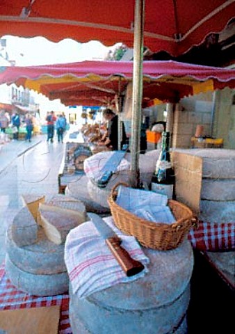 Savoie cheese stall in the market at   Beaune Cte dOr France