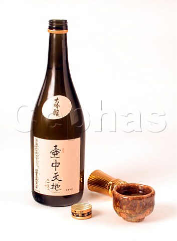 Bottle of Japanese sake rice wine with ochoko cup