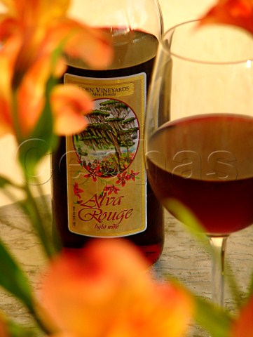 Bottle and glass of Florida Eden Vineyards Winery   Alva Rouge wine