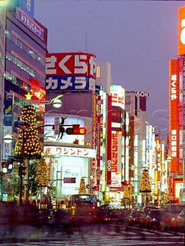 Neon advertising in Shinjuku Avenue at dusk   Shinjuku district Tokyo Japan