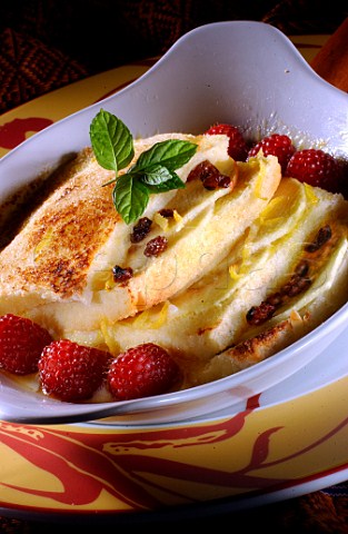 Bread and butter pudding with raspberry and mint  garnish