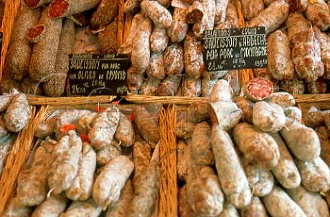 Stall selling saucissons in the market   at IlesurlaSorgue Vaucluse France