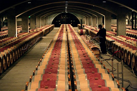 Filling barriques in the barrel cellar of the Robert   Mondavi Winery  Oakville Napa Valley California