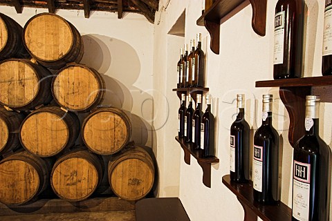 American oak barrels and display of Madeira wine   bottles in the tasting room at Henriques  Henriques   winery Ribeira do Escrivao Quinta Grande Madeira   Portugal