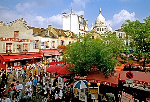 Elevated view from Chez Eugene restaurant balcony on Place du Tertre with Sacr Coeur cathedral beyond Montmartre Paris France