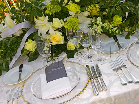 Luxurious table place setting at outdoor wedding   reception