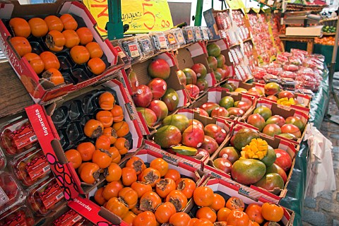 Persimmons and mangoes on a market stall at March   Mouffetard Rue Mouffetard Paris France
