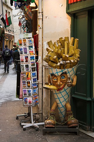 Model of a giant bag of chips outside a small caf   Rue X Privas Paris France