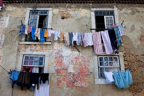 Washing hanging from windows in Alfama Old Lisbon   Portugal