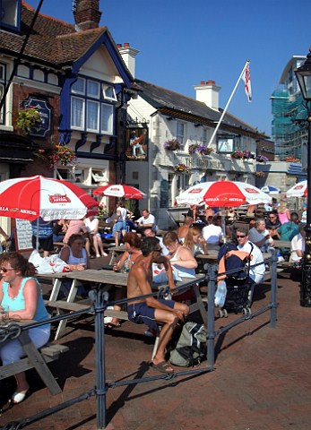 People drinking outside the Jolly Sailor public   house Poole Dorset England