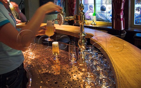 Pouring a glass of Bitburger beer in the Bitchen   bar Bernkastel Mosel Germany