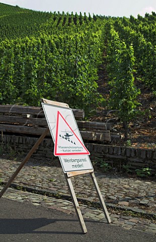 Road sign warning of helicopter spraying in vineyard   above Graach Germany  Mosel