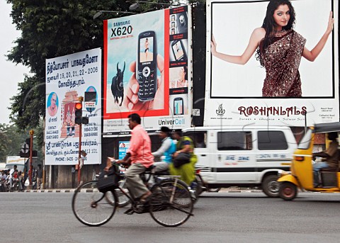 Traffic passing in front of huge billboards Chennai   Madras India