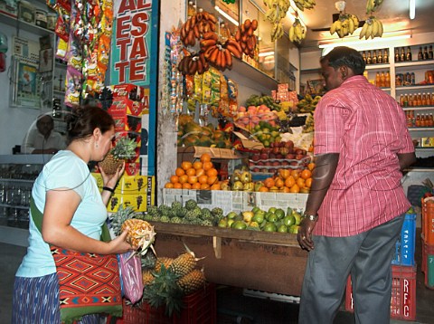 Pineapples being bought at fruit store Chennai   Madras India