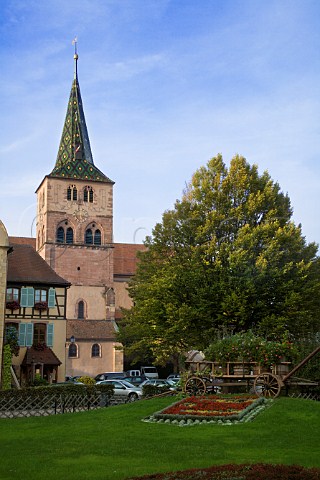 Flower display and church in Turckheim HautRhin   France  Alsace